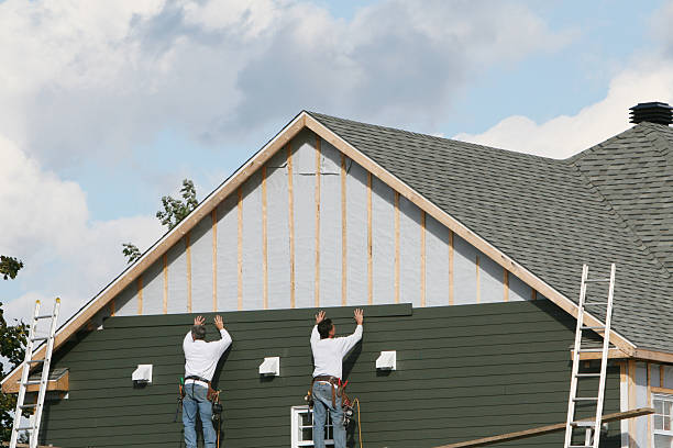 Professional Storm Damage Siding Repair technician working in Cowansville, PA